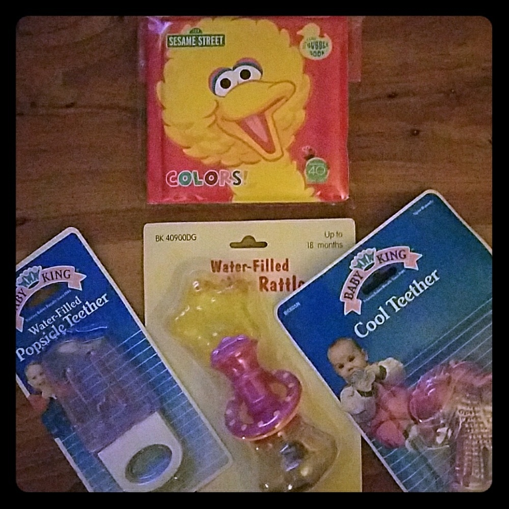 Baby teethers and rattles and book
